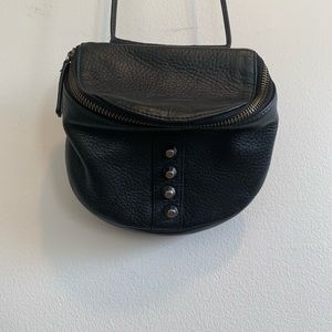 Black leather over-the-shoulder purse with studs